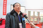 总裁判长谭衡鸣接受记者采访